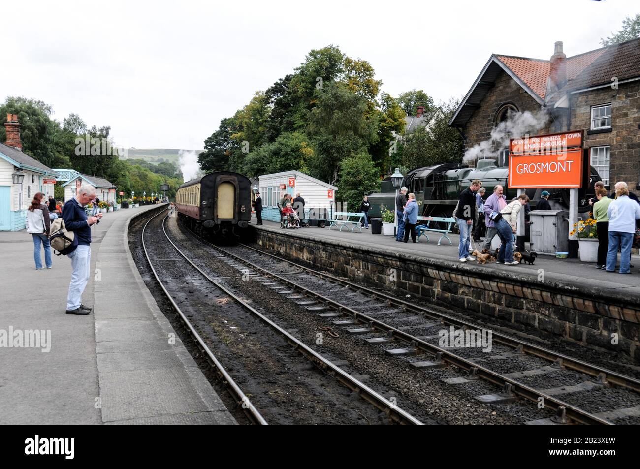 Tourists at Grosmont rail station on the NYMR (North Yorkshire Moors Railway) in North Yorkshire, Britain. Stock Photo