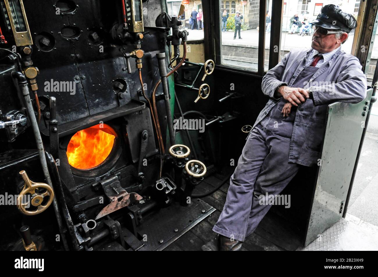 A steam engine driver on the footplate of the steam No
