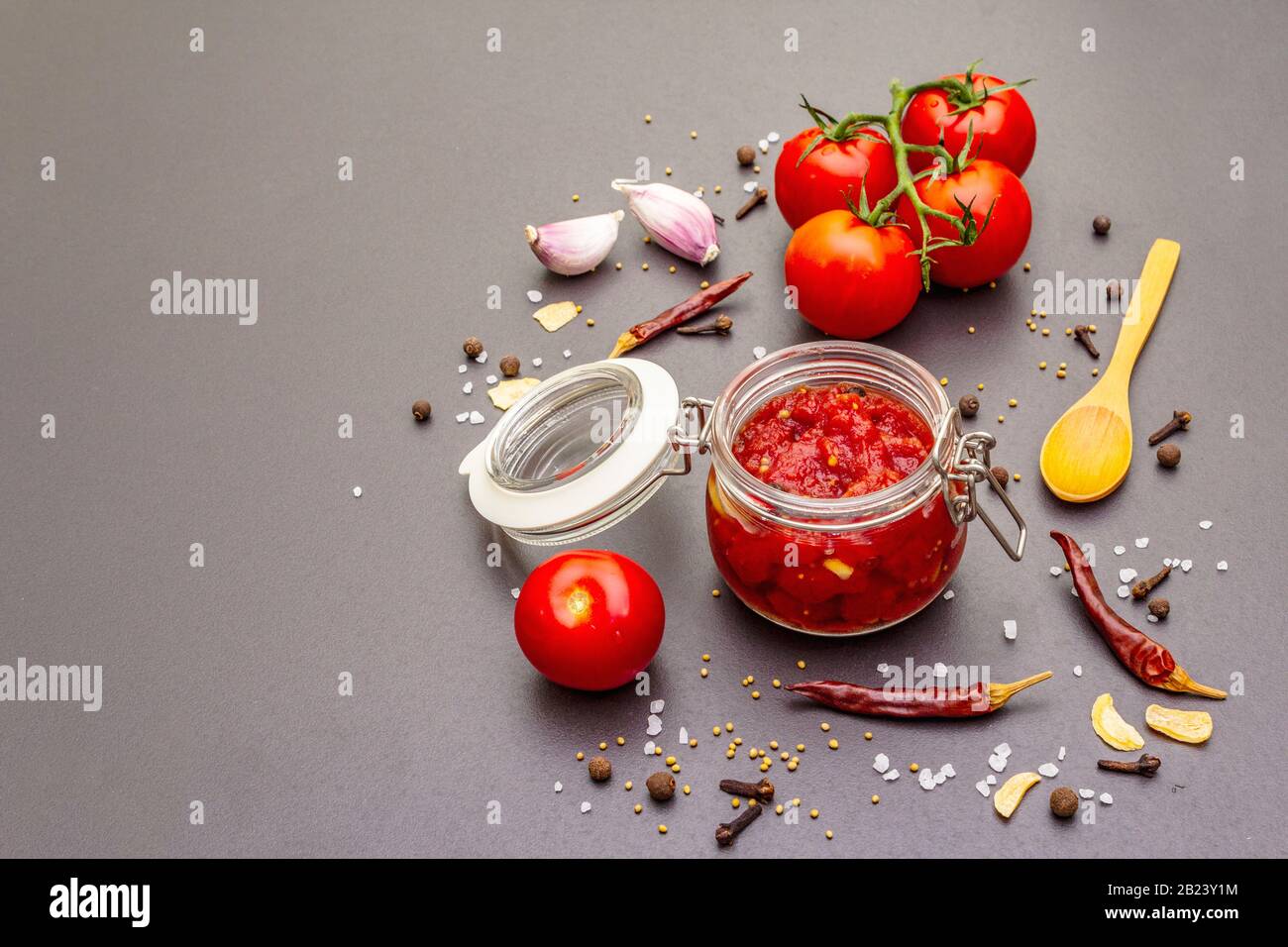 Tomato confiture, jam, chutney, sauce in glass jar. Homemade