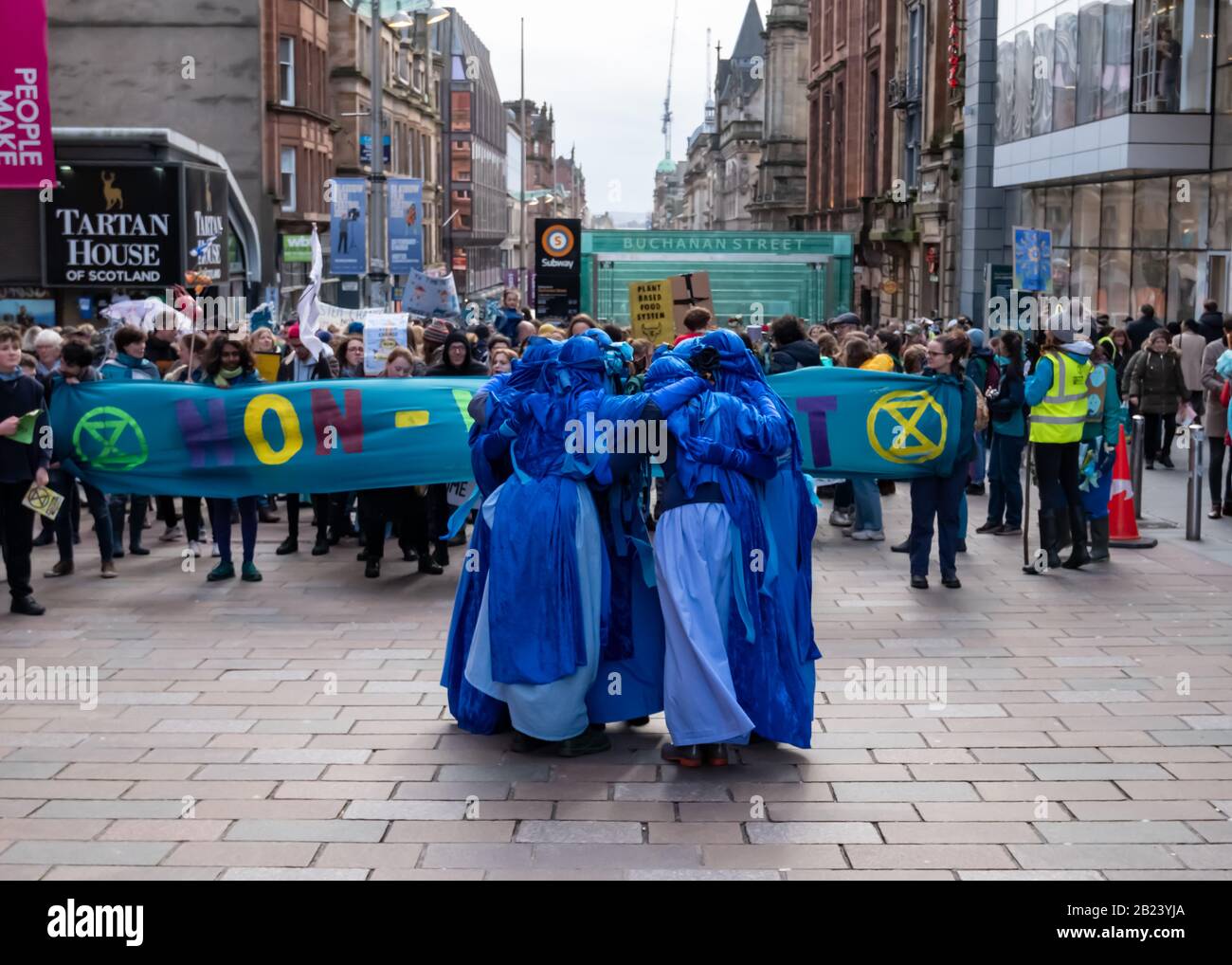 Glasgow, Scotland, UK. 29th February, 2020. The Blue Rebels leading the Blue Wave protest by the environmental campaign group Extinction Rebellion (XR) which saw activists  dressed in blue and green to represent the rising sea levels and flooding caused by increasing global temperatures and climate change. Credit: Skully/Alamy Live News Stock Photo