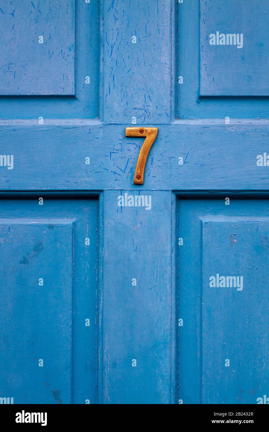 House number 7 on a blue door Stock Photo Alamy
