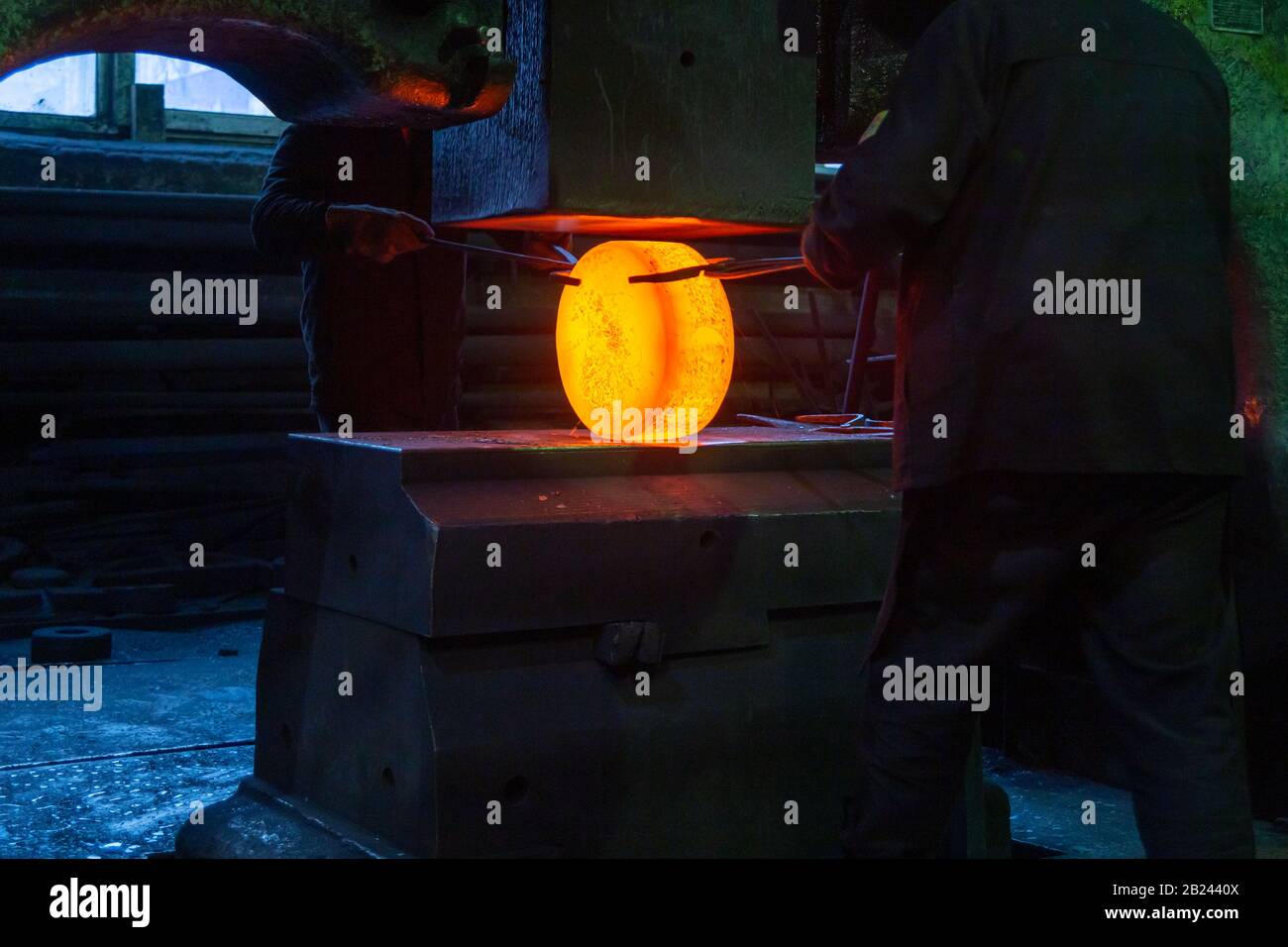 closeup picture of hot steel manual process with big