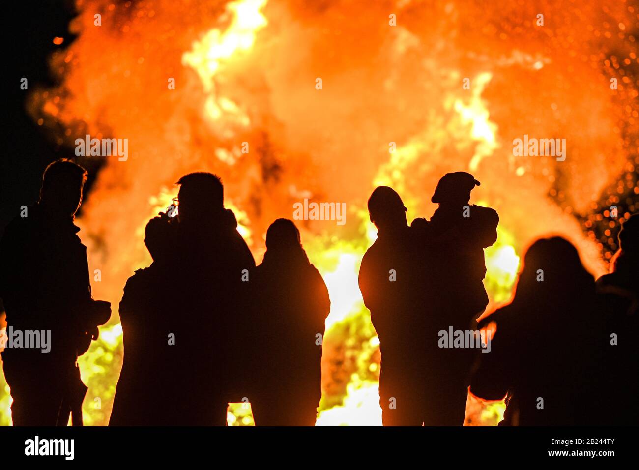 Meersburg, Germany. 29th Feb, 2020. Visitors look at the spark fire that was lit in the evening at the Wetterkreuz above Lake Constance. Credit: Felix Kästle/dpa/Alamy Live News Stock Photo