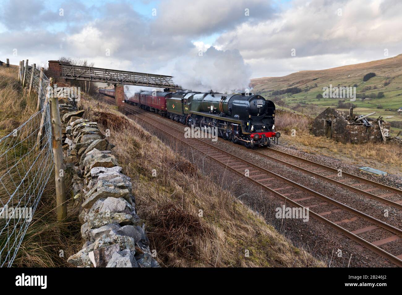 Shoregill near Kirkby Stephen, Cumbria, UK. 29nd February, 2020.The 'Winter Cumbrian Mountain Express' special hauled by steam locomotive 'British India Line'' 35018 seen here steaming south through the Eden Valley in the Yorkshire Dales National Park on famous Settle to Carlisle railway line. Credit: John Bentley/Alamy Live News. Stock Photo