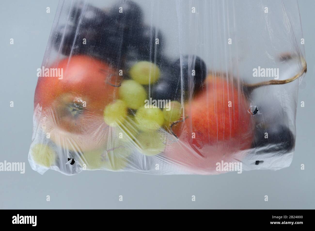 Fruit in plastic bag, Germany Stock Photo
