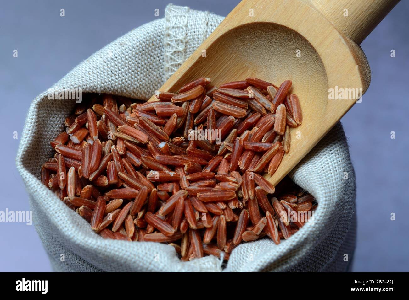 Red rice with wooden shovel, rice, Germany Stock Photo Alamy