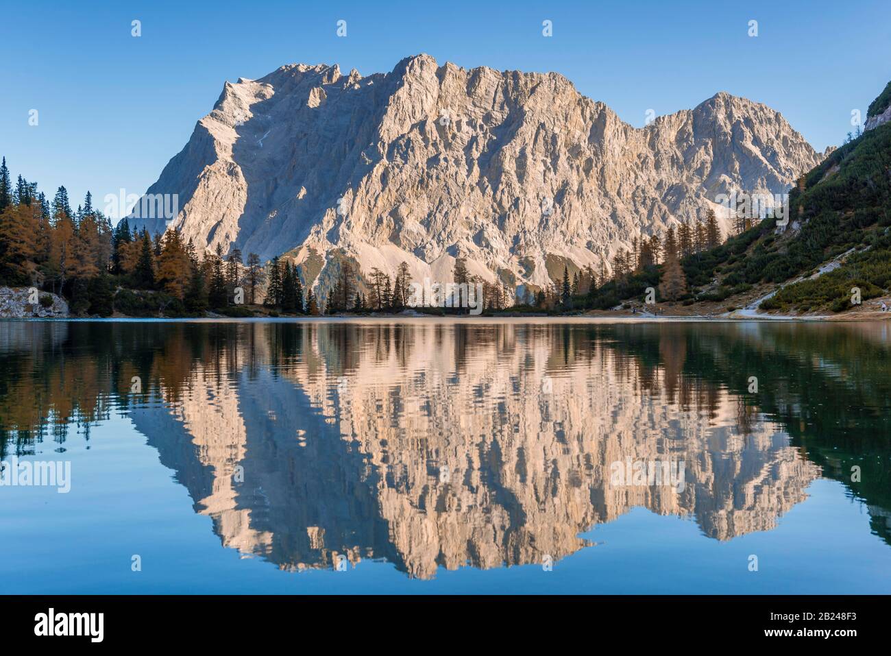 Zugspitze is reflected in the Seebensee, Ehrwald, Wetterstein range Tyrol, Austria Stock Photo