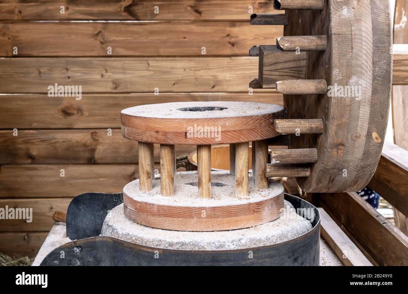 Millstone for grinding grain in an old water mill. Stock Photo