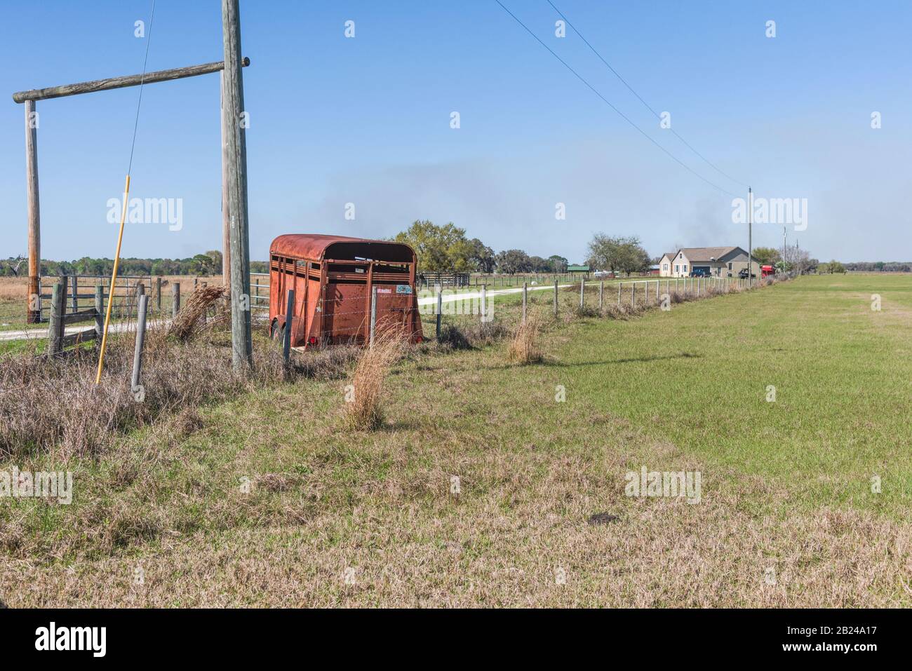 Typical Florida Roadside Farmland displaying an old rusted trailer. Stock Photo
