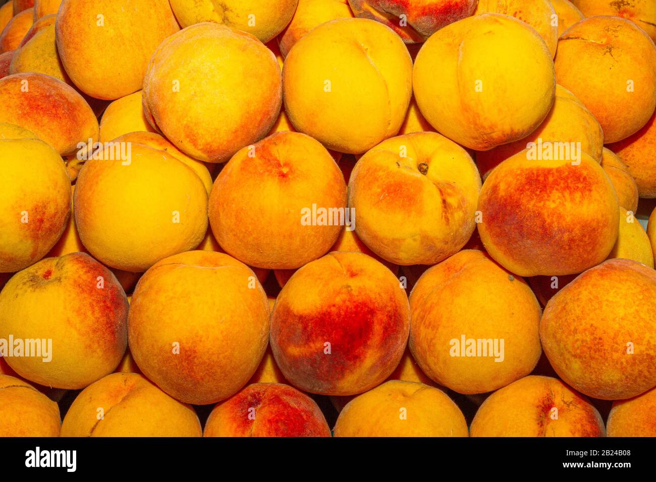 High energy antioxidant food, health booster juicy peaches super fruit on sale at local fruit market. Nutrition healthcare concept. Stock Photo