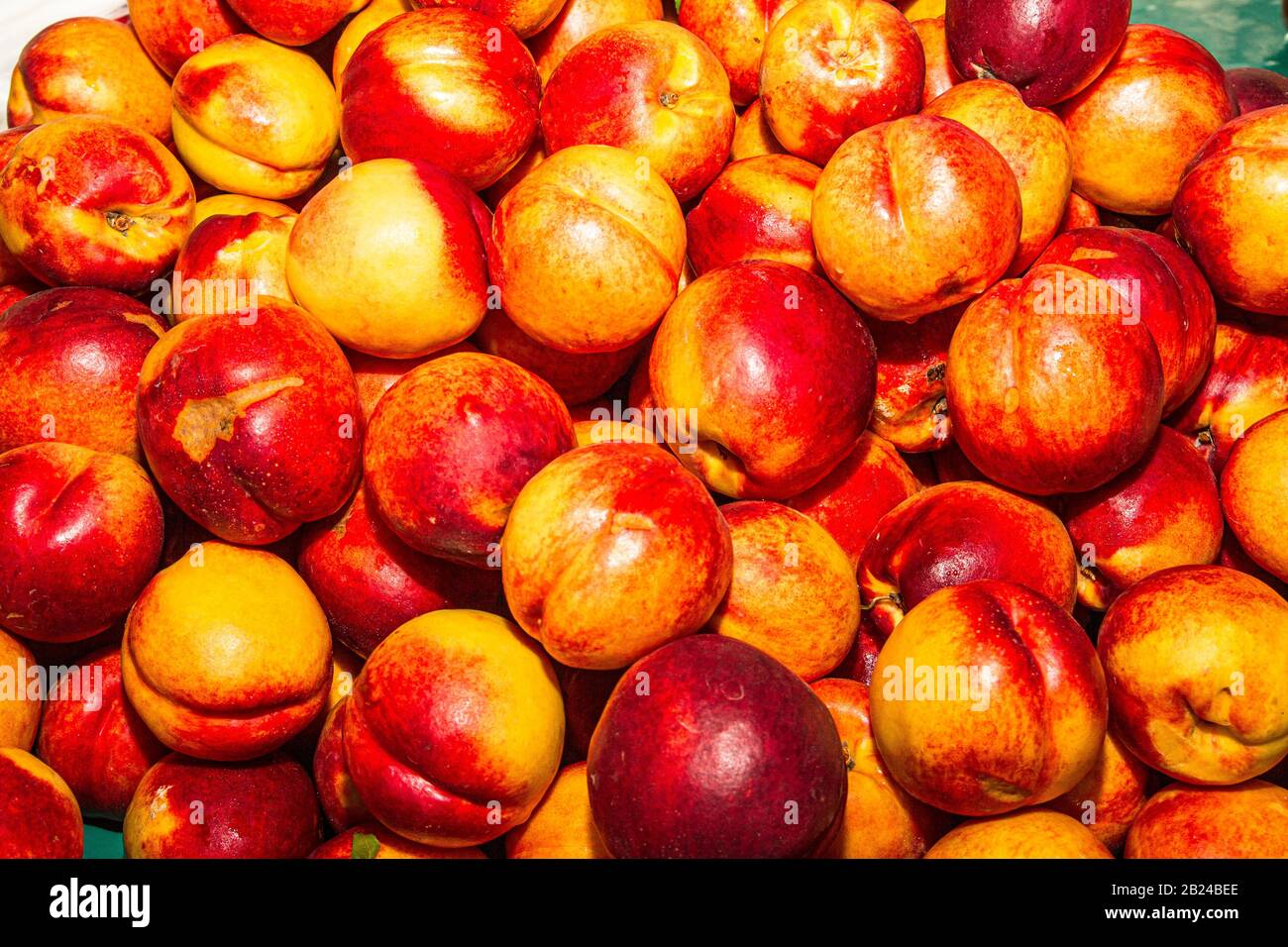 High energy antioxidant food, health booster juicy neactarines super fruit on sale at local fruit market. Nutrition healthcare concept. Stock Photo