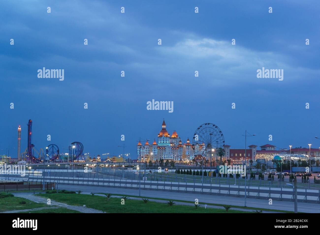 Sochi, Krasnodar Krai, Russia - June 06.2017: Evening lights entertainment Sochi Park, hotel 'Bogatyr' Stock Photo