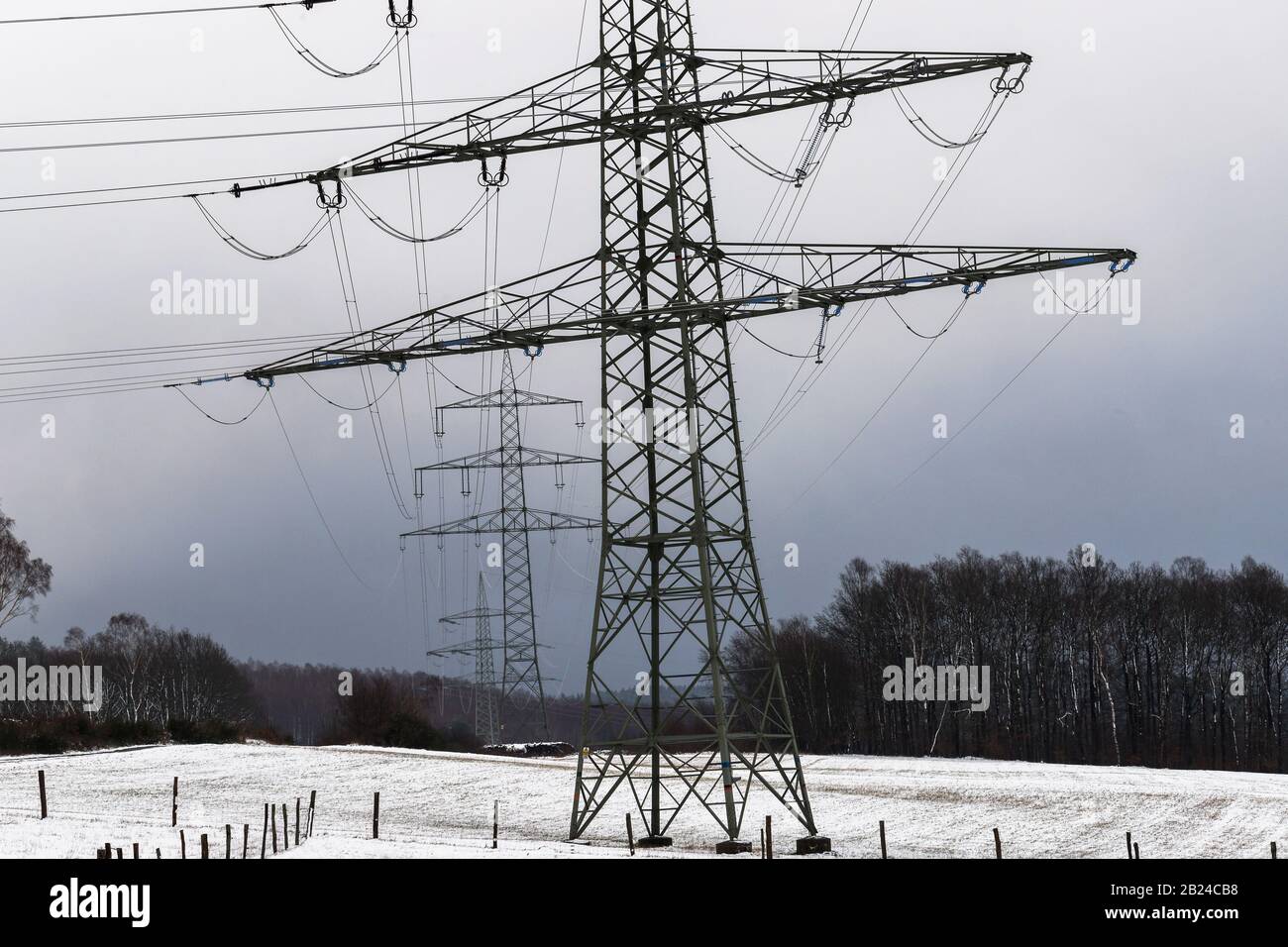 electricity pylons in a winter landscape Stock Photo - Alamy