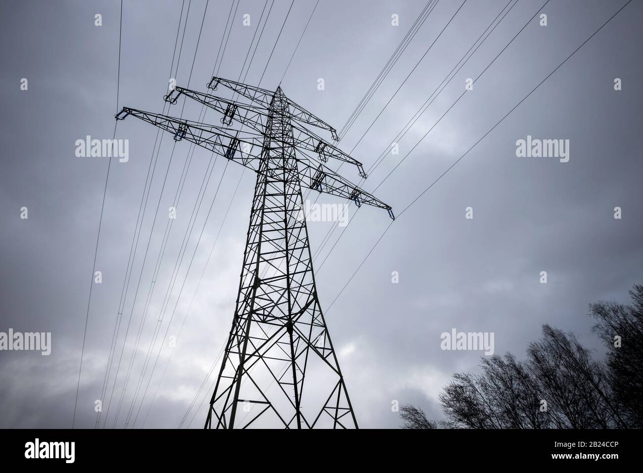 an electricity pylon in a winter sky Stock Photo - Alamy