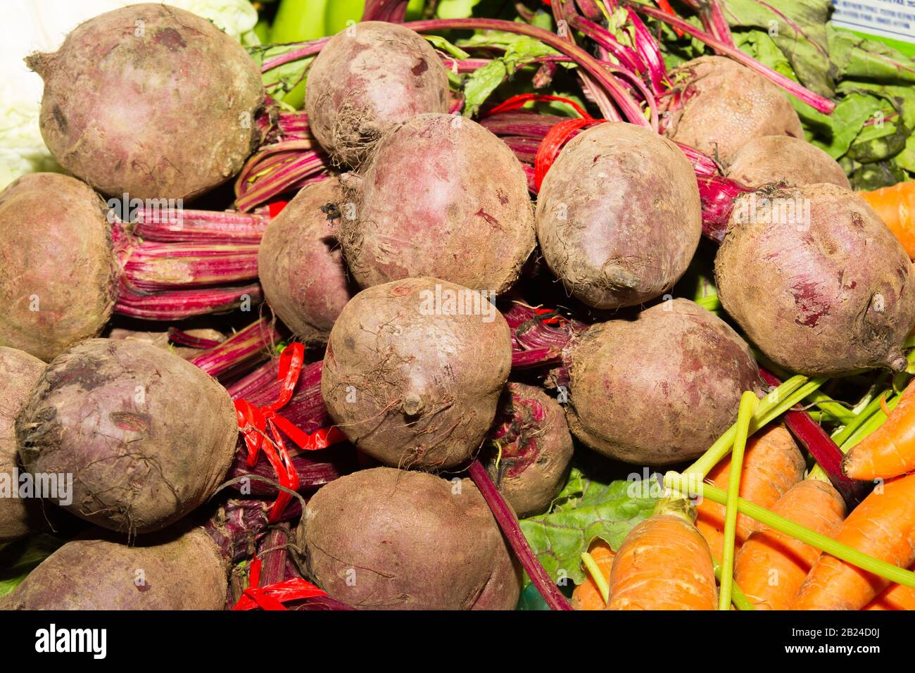 Fresh beetroots for sale on the counter of a mediterranean local outdoor fruit market Stock Photo