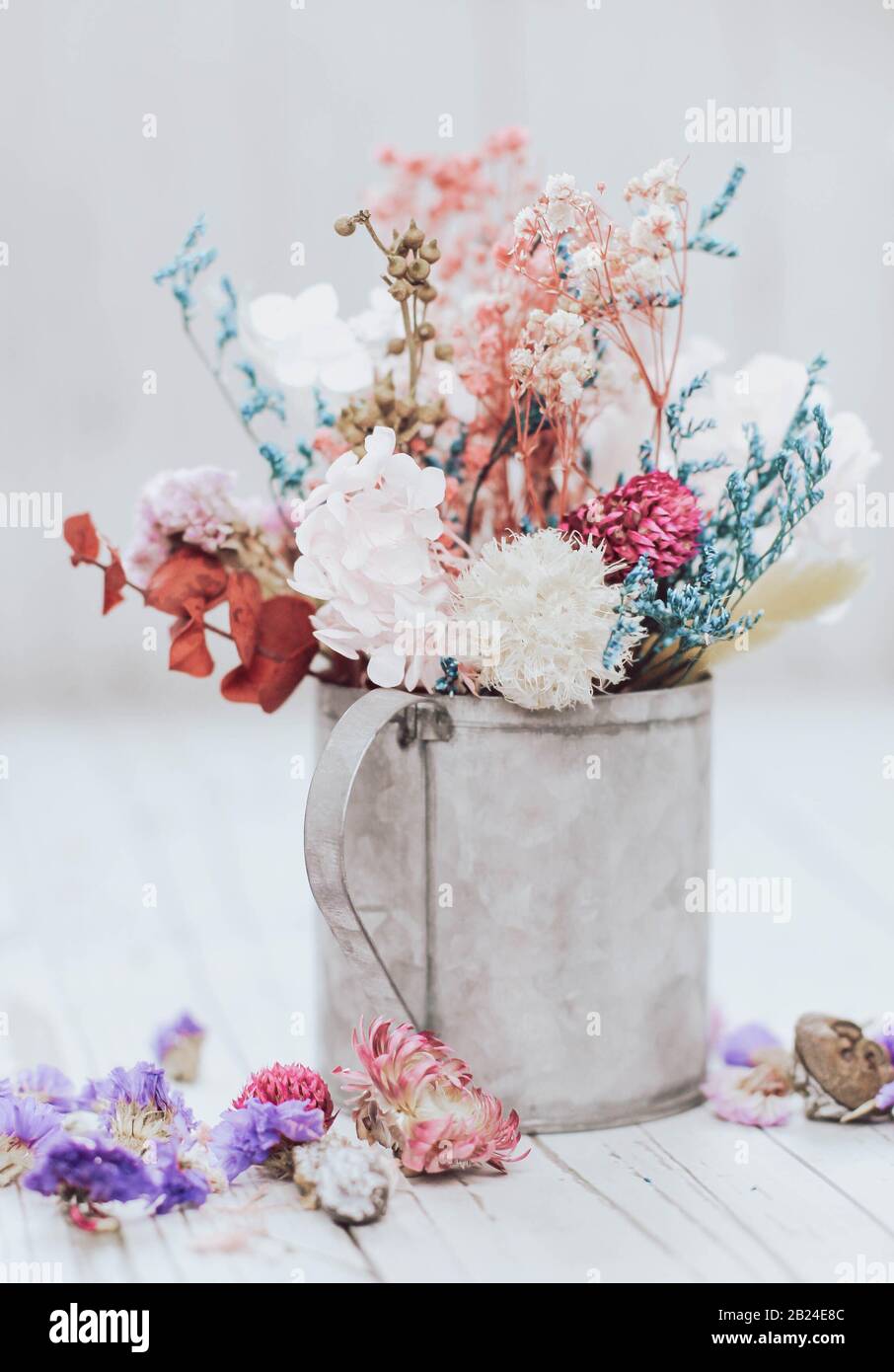 Dried flowers in a rustic cup. Boho composition. Romantic flower composition. Stock Photo