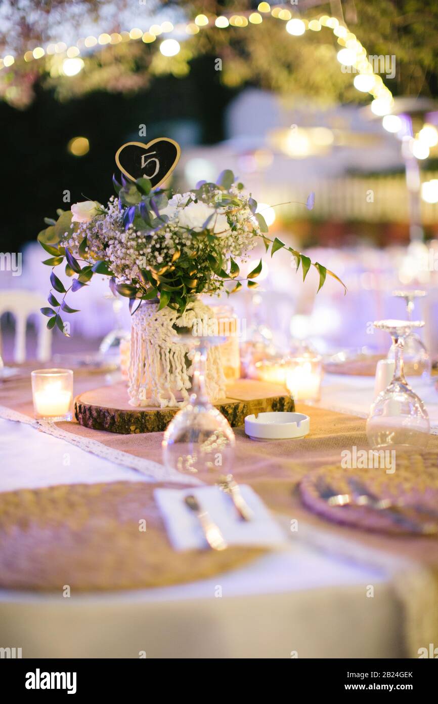 Wedding dining table. Table number nine. Rustic wedding. Stock Photo