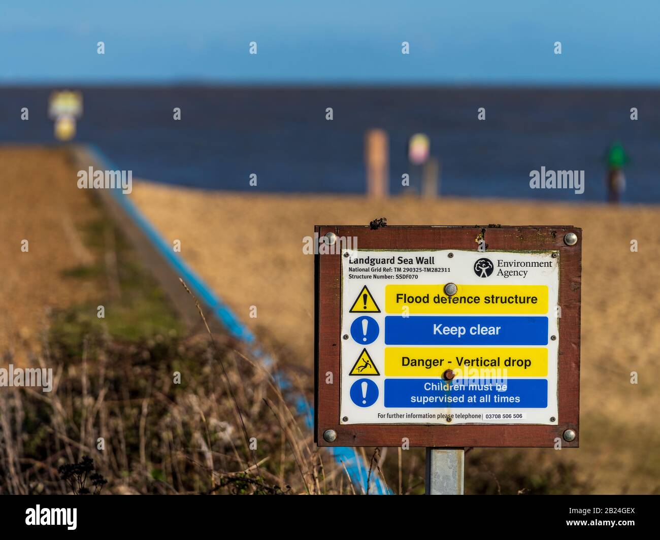 Environment Agency Flood Defence Structure Warning Sign at Landguard near Felixstowe Suffolk UK Stock Photo