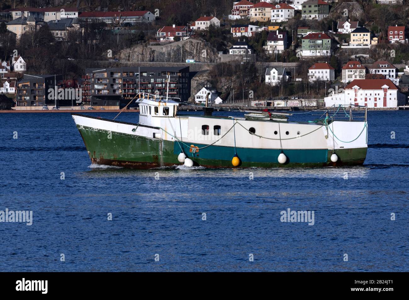 Originally a fishing vessel (built 1975), now a rebuilding project, the vessel Breiflu at Byfjorden, departing from the port of Bergen, Norway Stock Photo