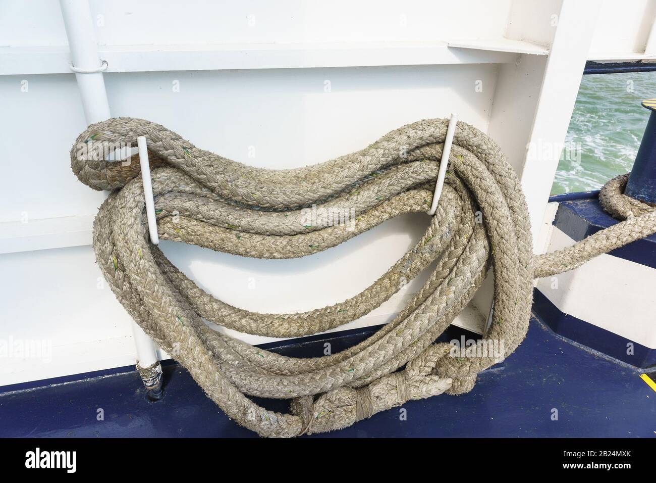 Folded mooring ropes for attaching the ship to the berth, mooring