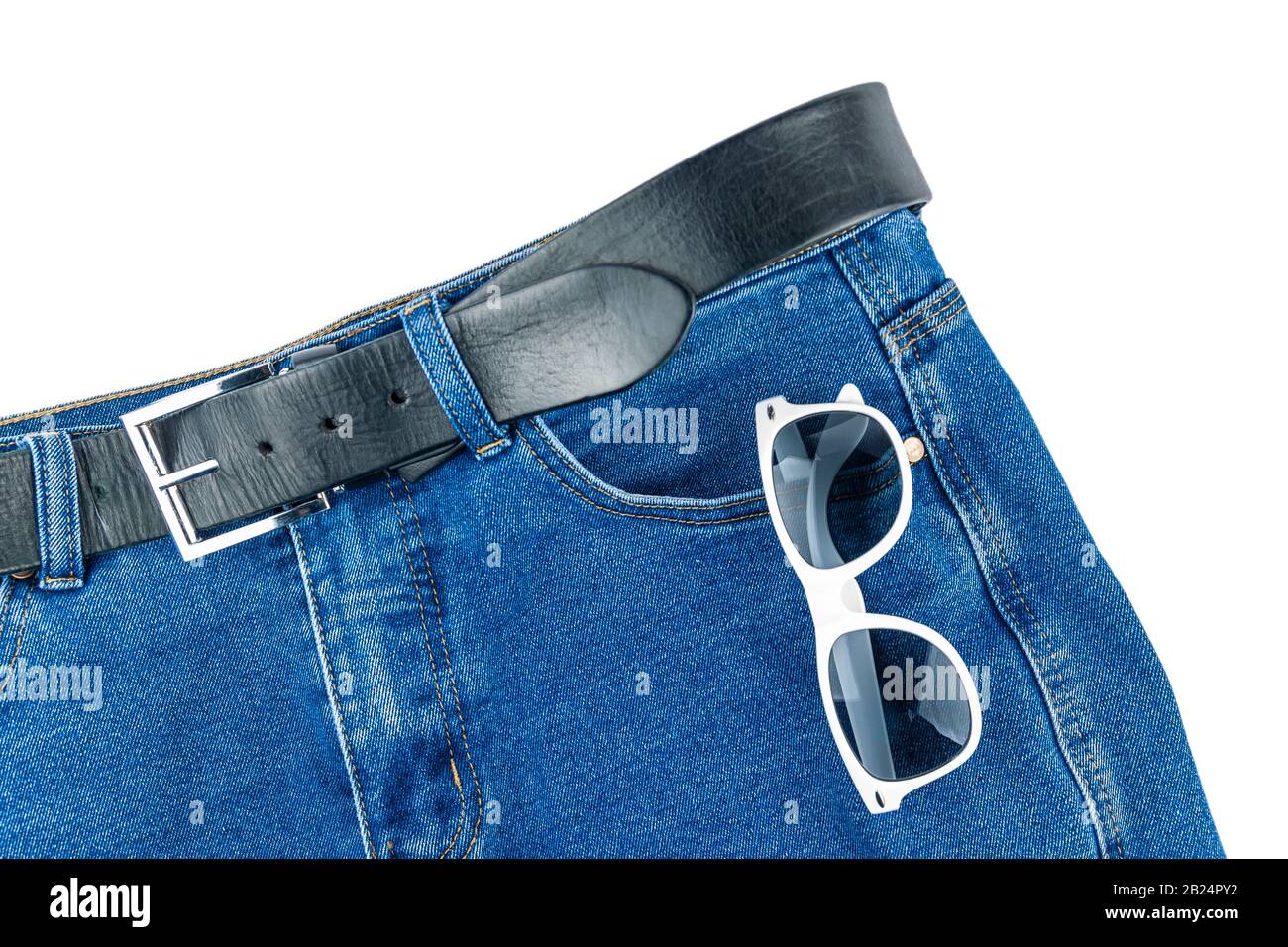 Trousers with sun-covered glasses lie on a white background. Stock Photo