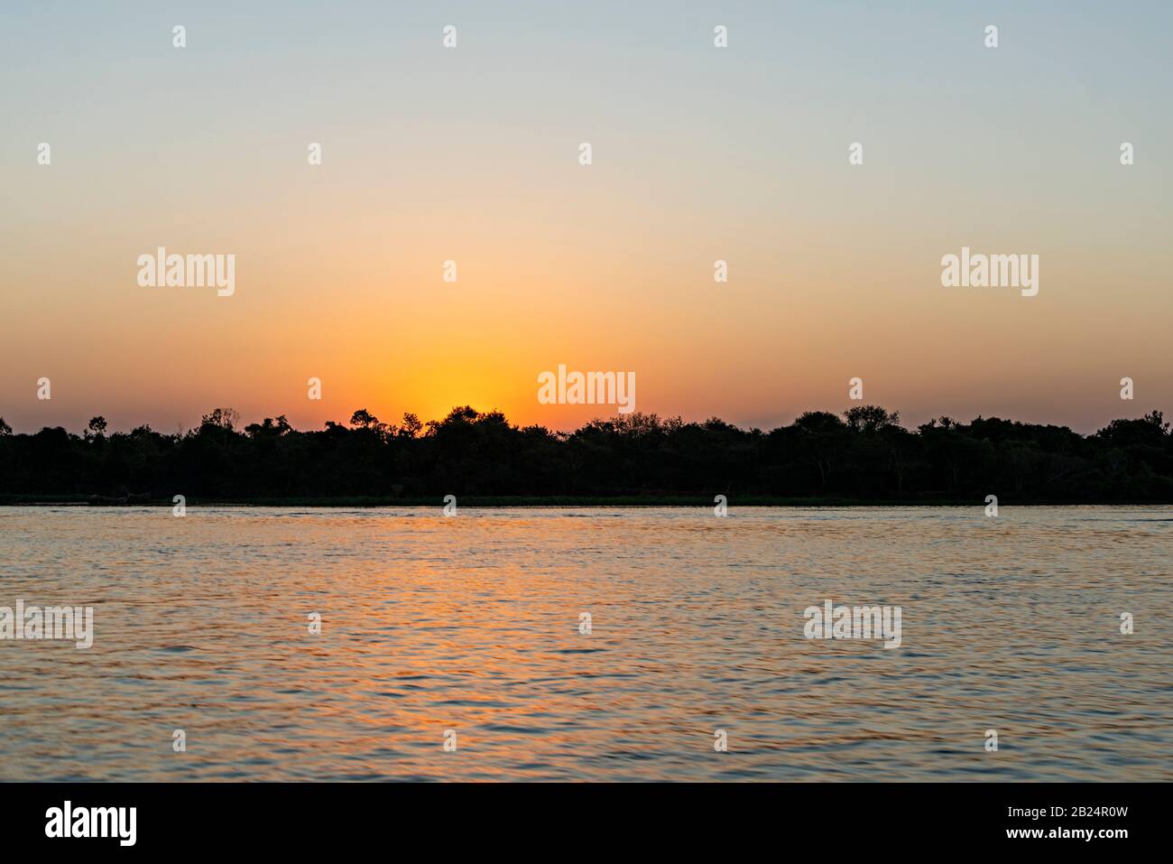 Sunset Over The Water Stock Photo