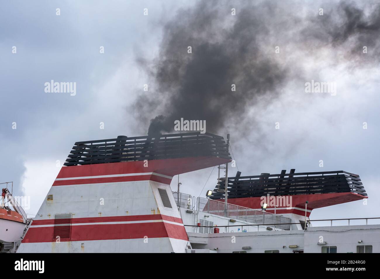 Ship chimneys expelling black smoke when starting engines Stock Photo Alamy