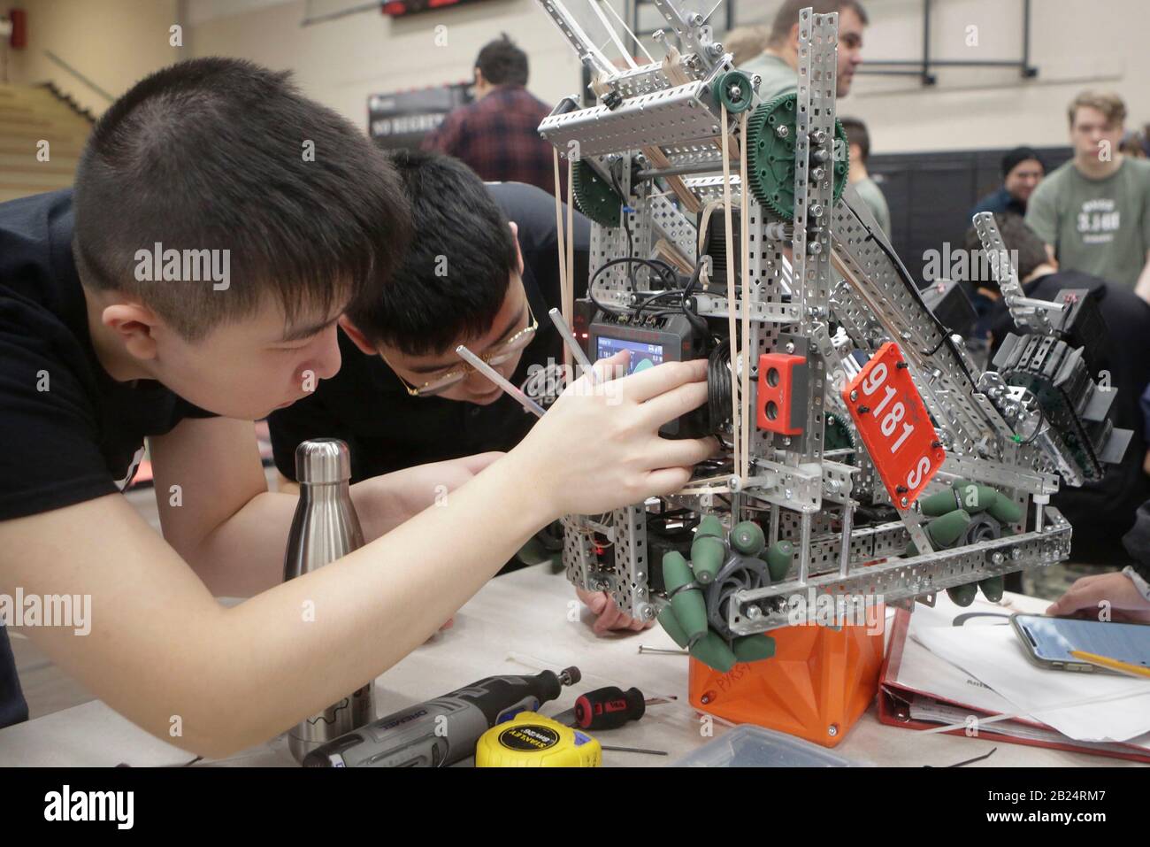 Vancouver, Canada. 29th Feb, 2020. Contestants tune up their robot during  the regional VEX robotics competition in Vancouver, Canada, on Feb. 29, 2020.  Hundreds of high school students teamed up with their