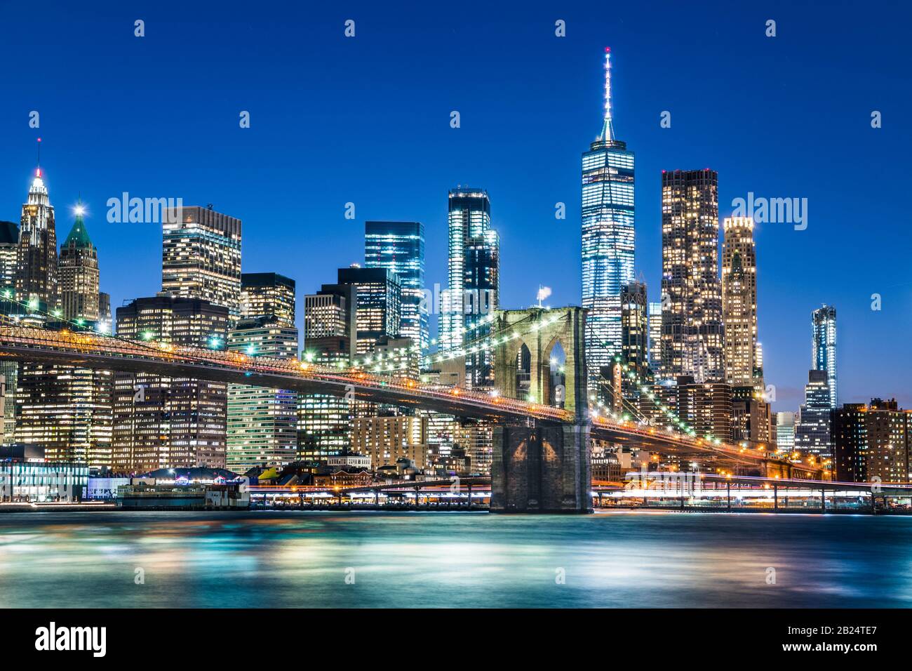New york city skyline with Brooklyn Bridge at night Stock Photo
