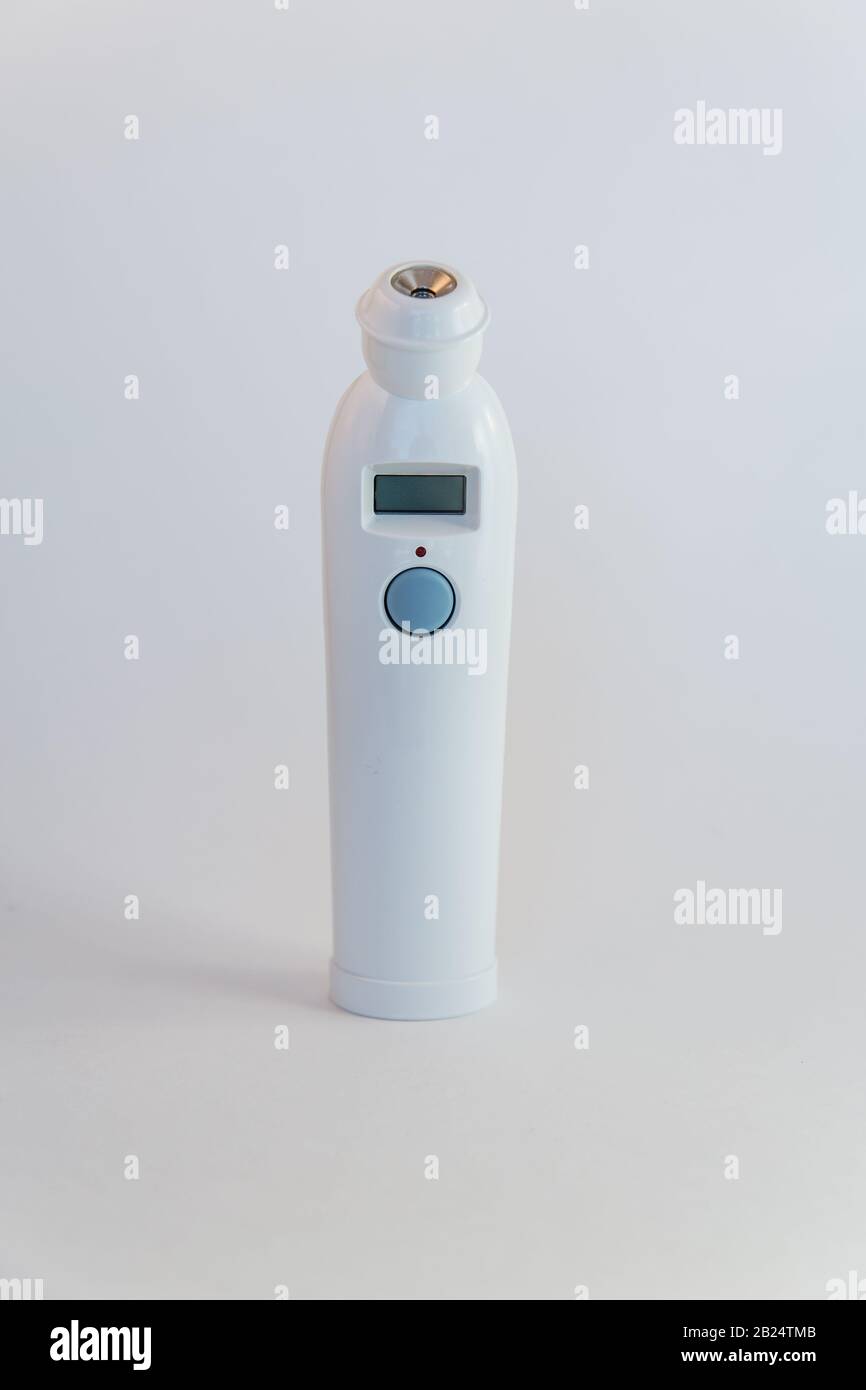 Temporal artery thermometer, vertical, no people Stock Photo