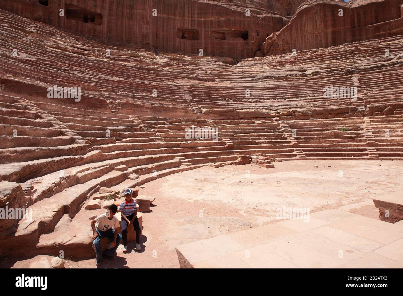 Petra, Jordan, April 30, 2009: A Nabataean theatre carved out of limestone rock of the ancient Nabataean city of Petra, Jordan. Stock Photo