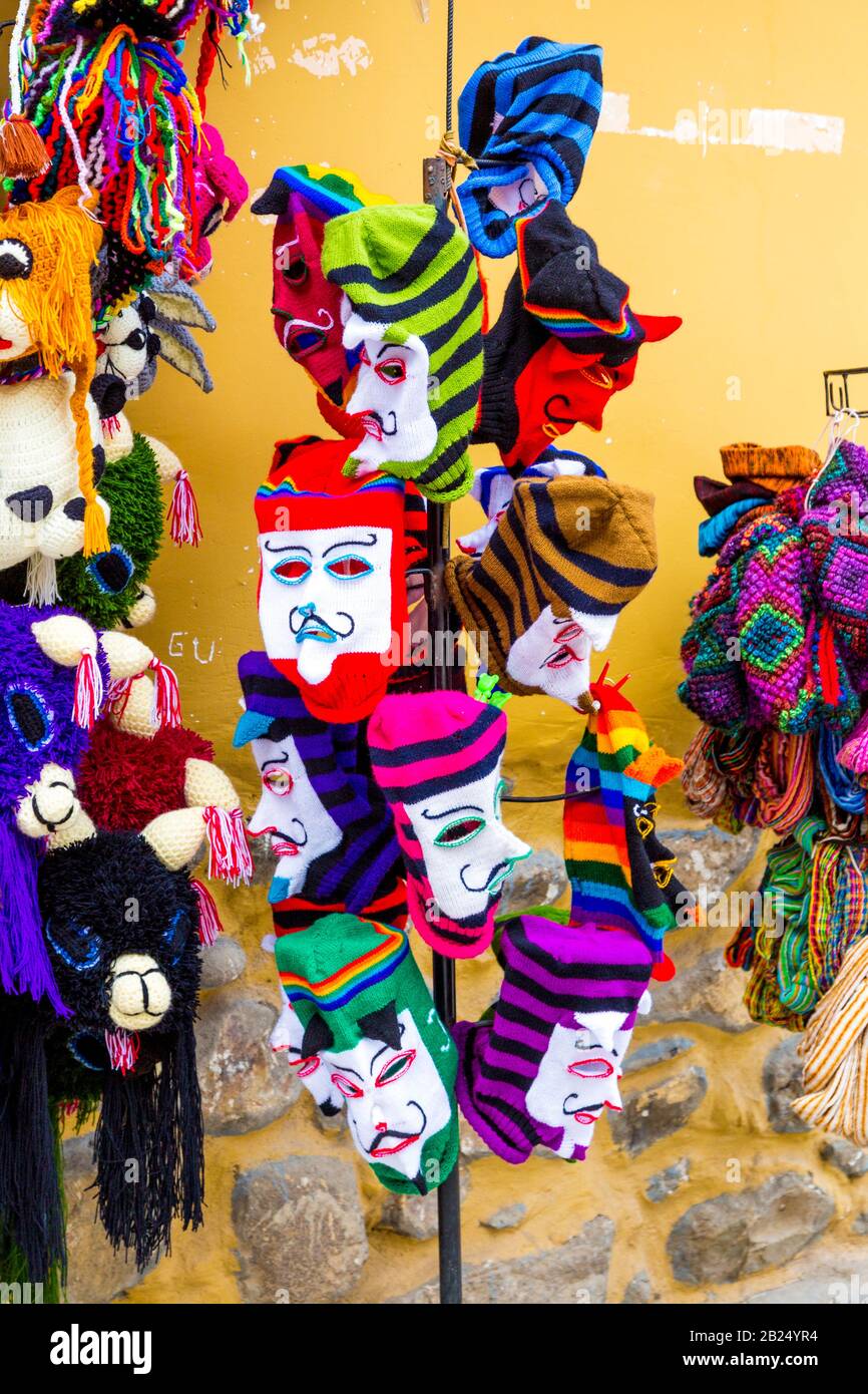 Traditional Peruvian knitted Waq'ollo face masks at a souvenir shop in Cusco, Sacred Valley, Peru Stock Photo