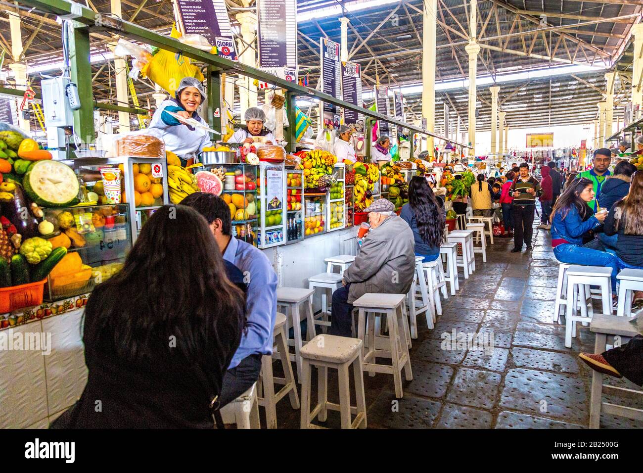 Fresh fruit juice stalls at San Pedro Market, Cusco, Sacred Valley, Peru Stock Photo