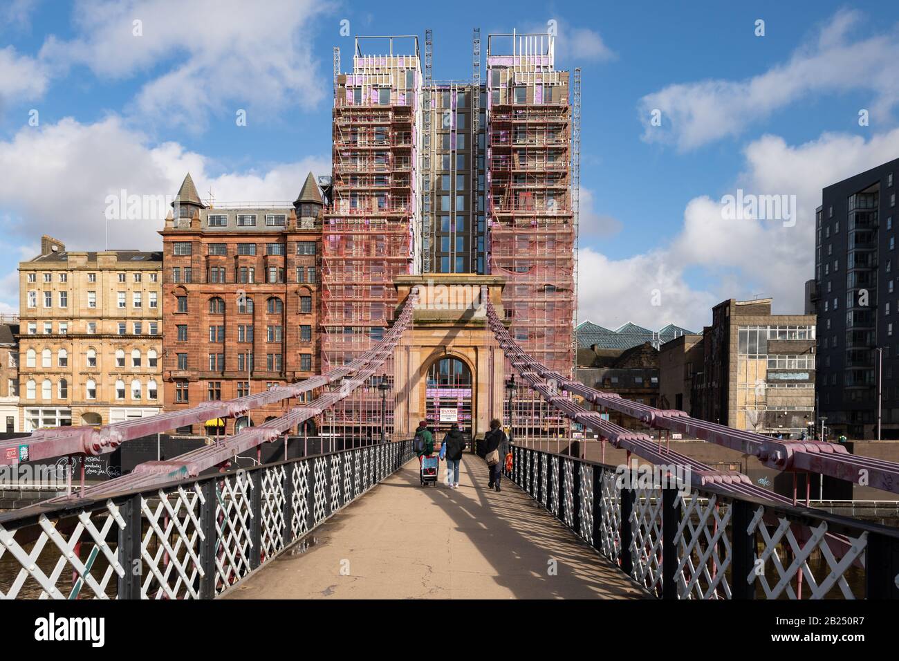 Construction of Accor Tribe Hotel, under construction on Clyde Street, Glasgow, Scotland as viewed from Portland Street suspension bridge Stock Photo