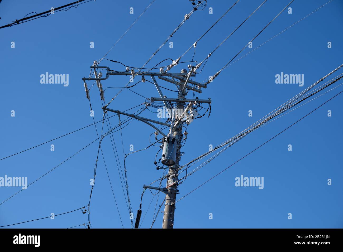 Pole with telephone and electricity cables in Tokyo, Japan. Stock Photo