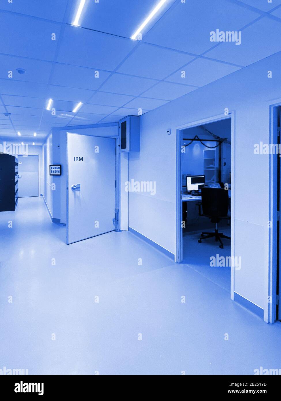 Open door of new IRM MRI resonance imaging room in ultra