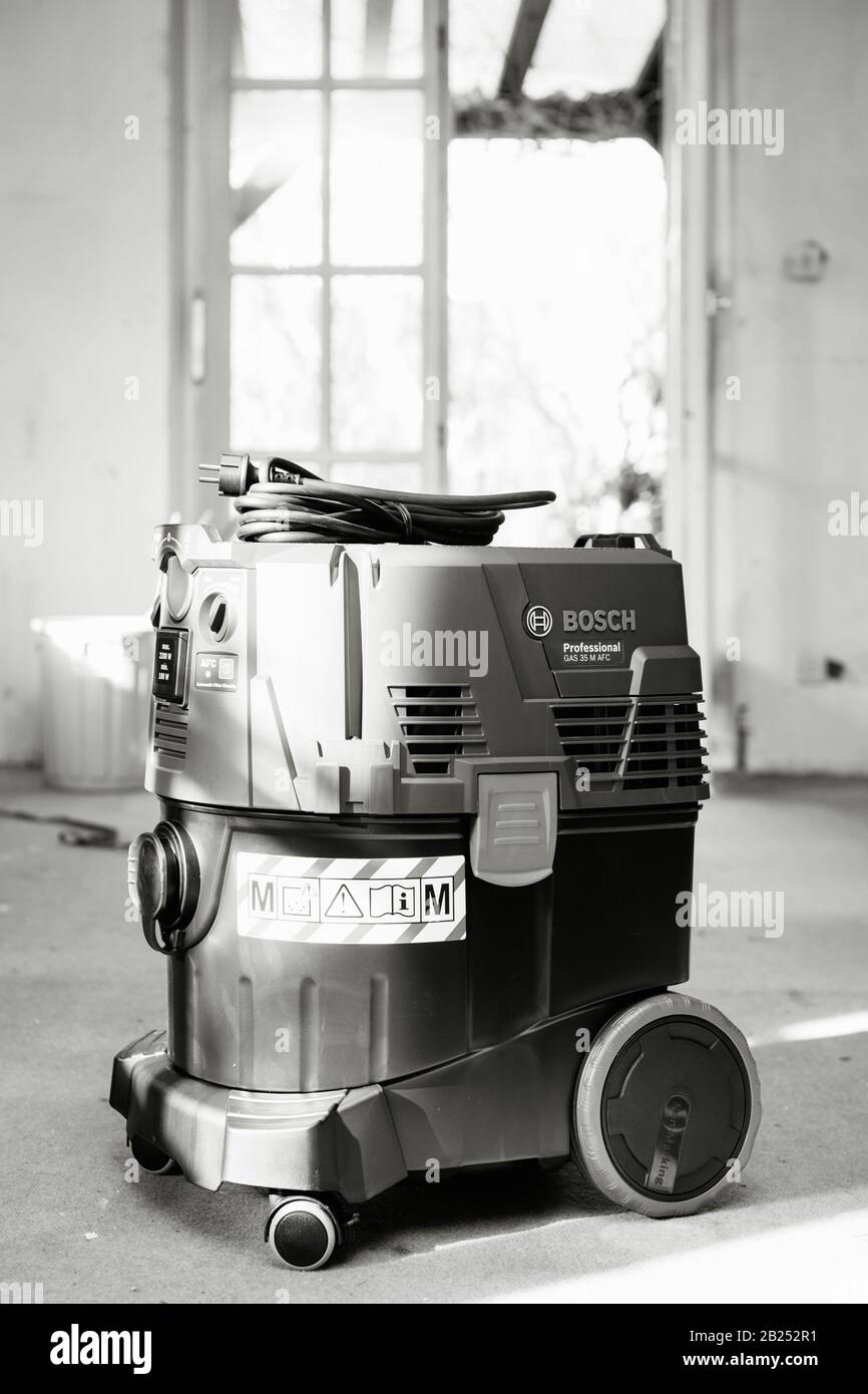 Strasbourg, France - Feb 9, 2020: Black and white Front view of Bosch  Professional Gas 35 M Class AFC with automatic filter cleaning system  extractor on the construction site concrete floor Stock Photo - Alamy