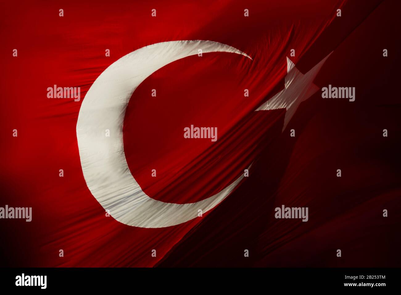 Photo of Glorious Real Turkish flag background texture waving with real wrinkles on it. Stock Photo