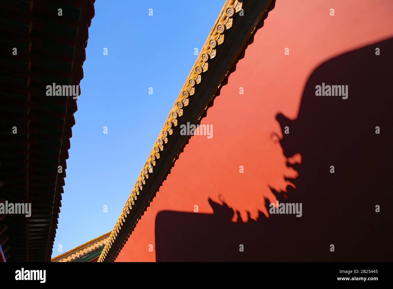 Red wall of the Forbidden City with shadow reflection, Beijing, China Stock Photo