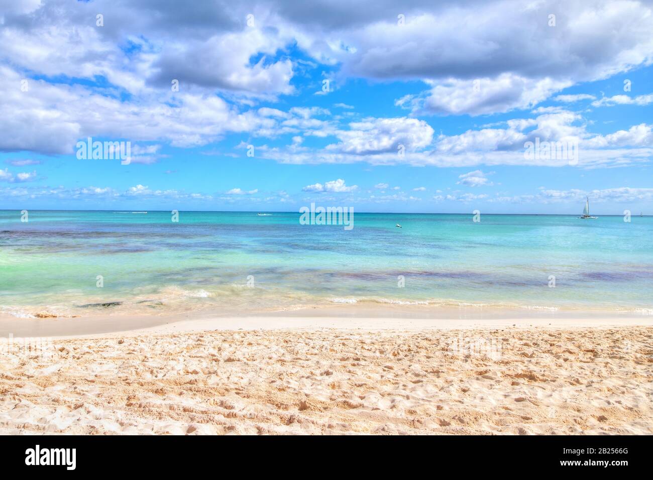 Empty sandy beach and sea with cloudy sky background and copy space. Stock Photo