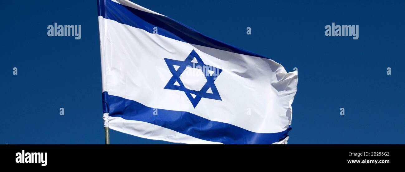 A computer-sized banner shows a close up of Israel's flag flying in the breeze. Stock Photo