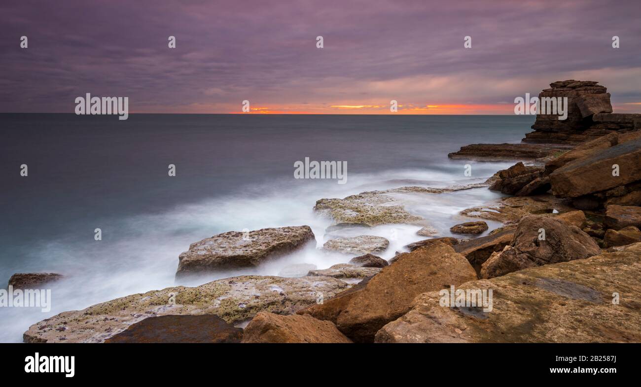 Long exposure of Pulpit Rock and the Jurassic Coastline at Portland Dorset Stock Photo