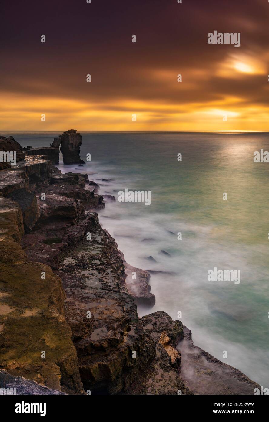 Long exposure of Pulpit Rock and the Jurassic Coastline at Portland Dorset Stock Photo
