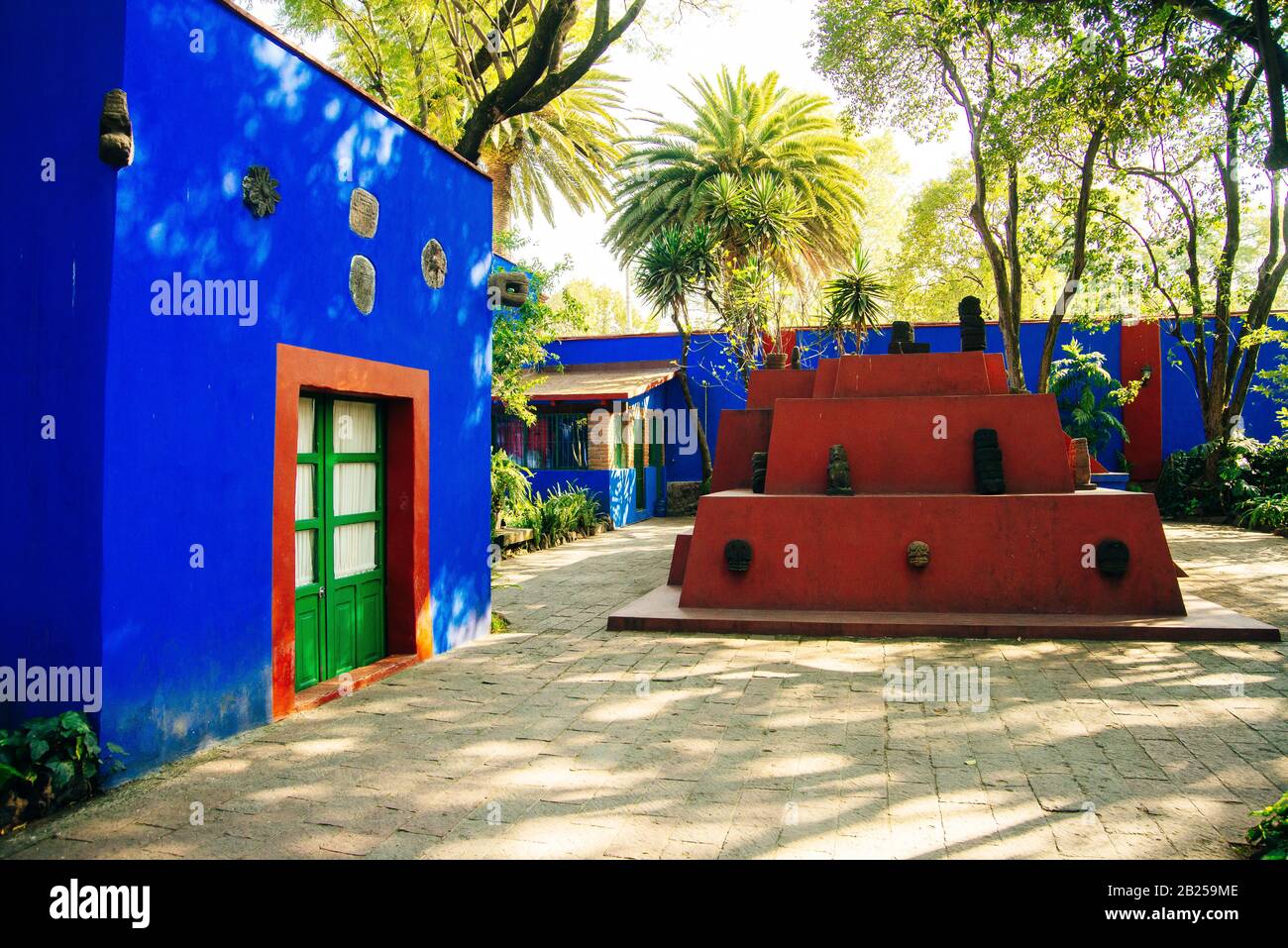 MEXICO CITY, MEXICO - DECEMBER 2019 Colorful courtyard at the Frida Kahlo Museum Stock Photo