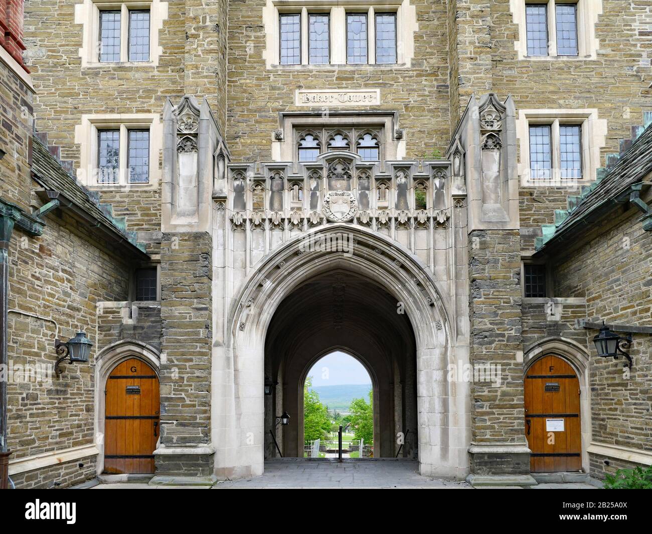 ITHACA, NY - MAY 2019:  Cornell University's campus has many elegant stone neogothic style buildings such as this residence hall named Baker Tower. Stock Photo