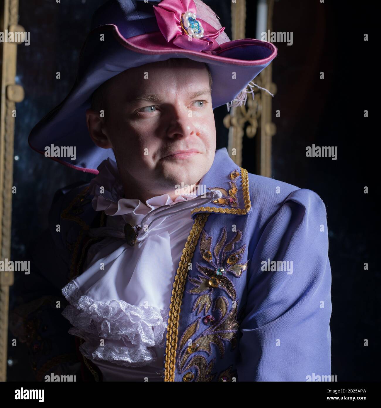 Actor dressed historical costume in interior of old theater Stock Photo ...