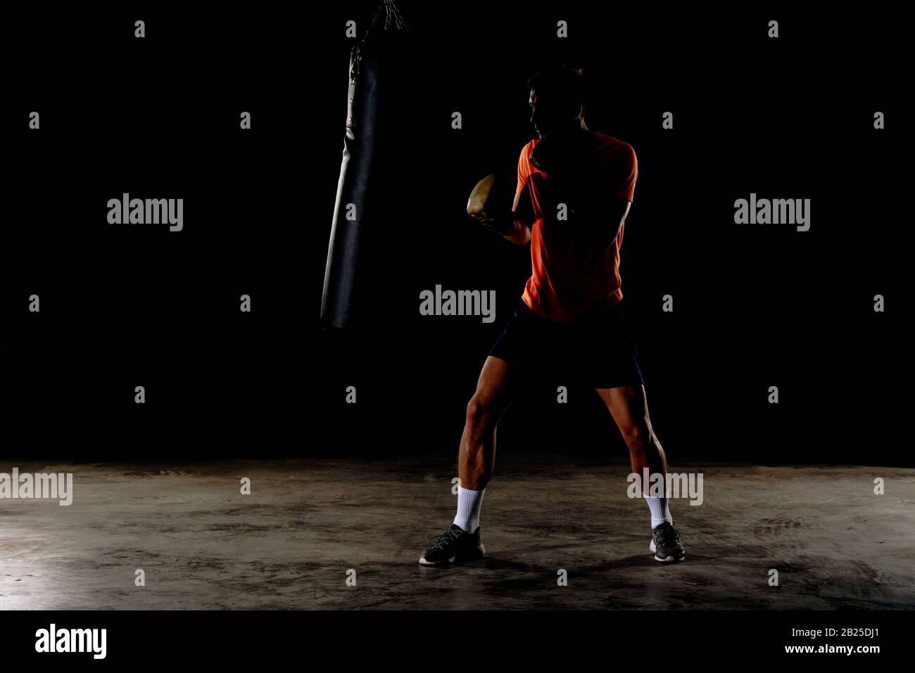 Professional boxer training at gym, practicing kicks and punches Stock ...