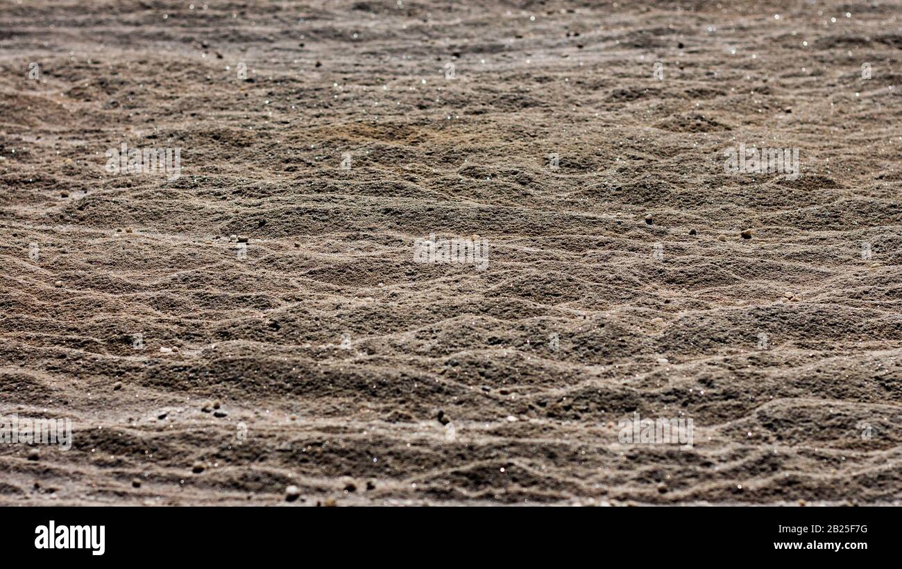 Sandstone rock face surface layers weathered by seaside, ideal as natural geologic background Stock Photo