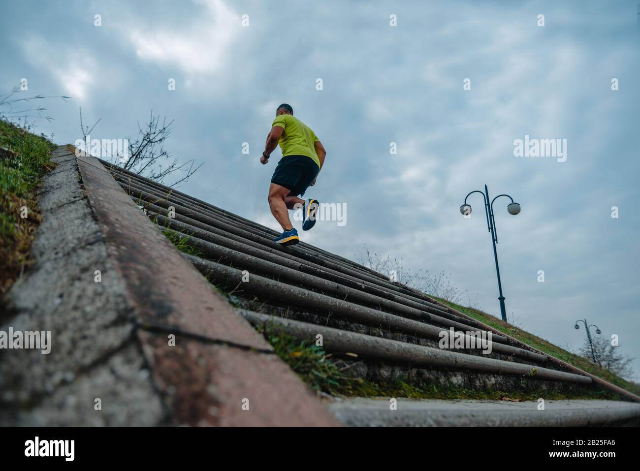Mature man running up stairs hi-res stock photography and images - Alamy