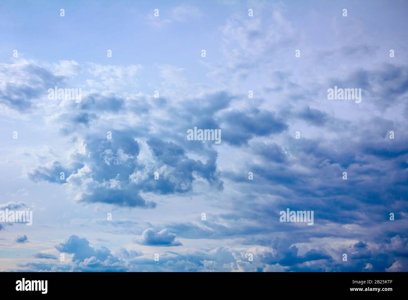 View of cumulus cloudscape on the blue sky before storm, altostratus cloud texture. Stock Photo
